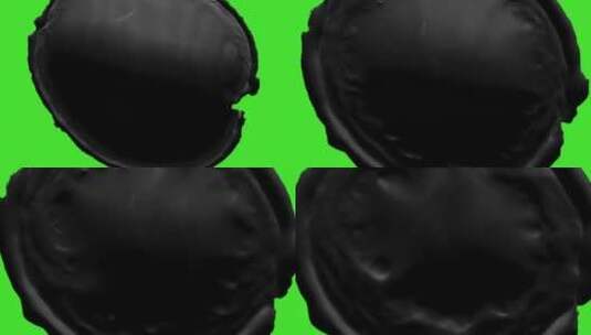 黑色墨水覆盖在绿色背景上高清在线视频素材下载