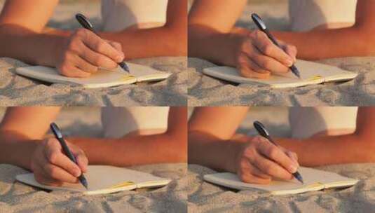 沙滩在本子上写字高清在线视频素材下载