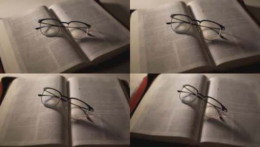 眼镜放在书上高清在线视频素材下载