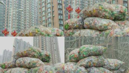 废品收购堆积在路边高楼前的旧塑料瓶高清在线视频素材下载