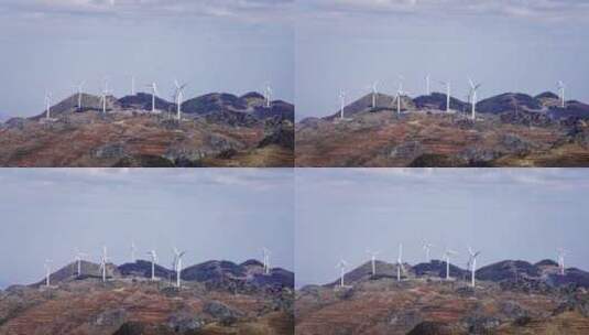 云南红土地丘陵上的风力发电大风车高清在线视频素材下载