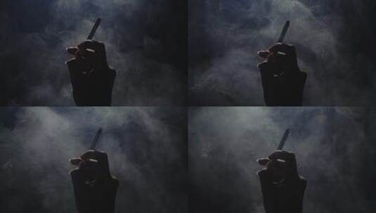 一只手叼着香烟烟雾慢镜头5高清在线视频素材下载