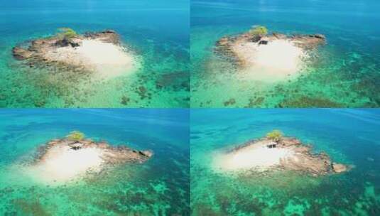 航拍海中小岛礁石清透绿色大海马尔代夫高清在线视频素材下载