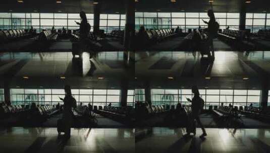 4K 一名女子拉着行李箱走在机场航站楼高清在线视频素材下载