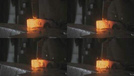 铁匠在锻造烧红的金属制品高清在线视频素材下载