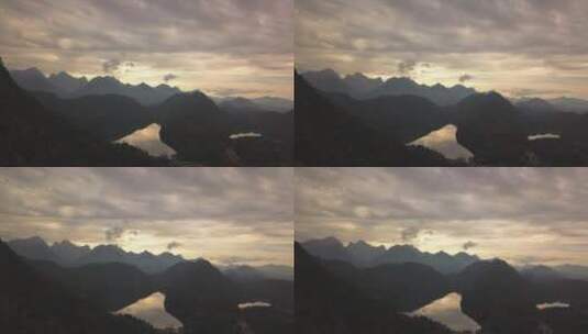 日落时分阴天群山的剪影高清在线视频素材下载