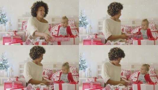 母亲给女儿展示圣诞礼物高清在线视频素材下载