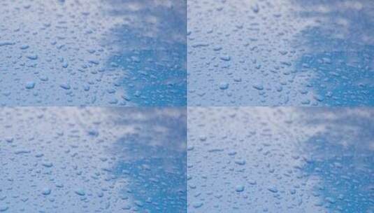蓝色汽车上的雨滴高清在线视频素材下载