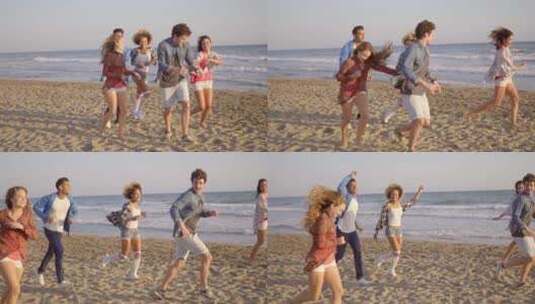 年轻人在沙滩上奔跑高清在线视频素材下载