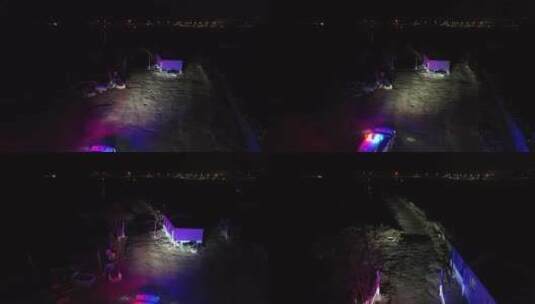 航拍黑夜中巡逻的警车灯光高清在线视频素材下载