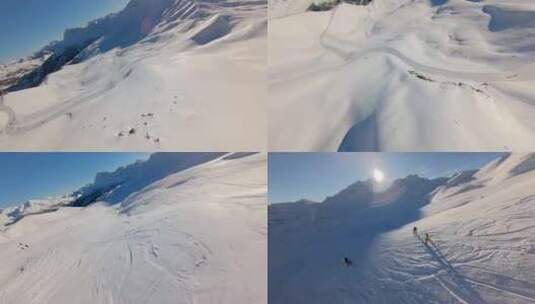 FPV穿越机无人机航拍滑雪雪山滑雪场阳光高清在线视频素材下载