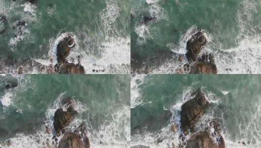 俯拍海浪冲刷岸边的礁石高清在线视频素材下载