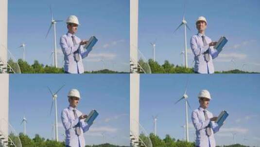 工程师控制风力涡轮机的运行，风力涡轮机依高清在线视频素材下载