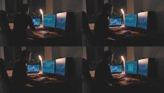 夜晚一男子在电脑前研究股票市场K线图高清在线视频素材下载