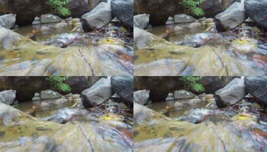 在岩石床上流淌的狭窄河流高清在线视频素材下载