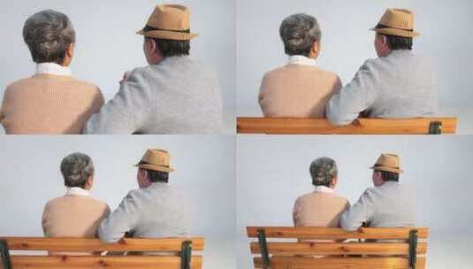 坐在长椅上聊天的老年夫妇背影高清在线视频素材下载