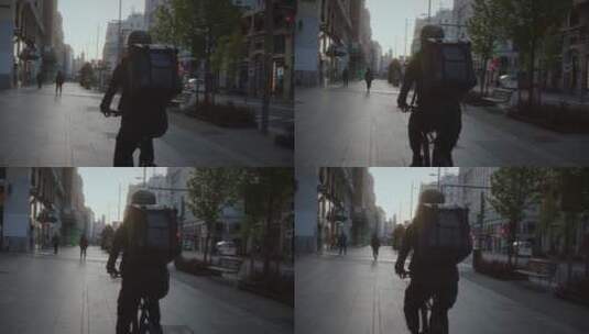 送货员在城市街道骑行的背影高清在线视频素材下载