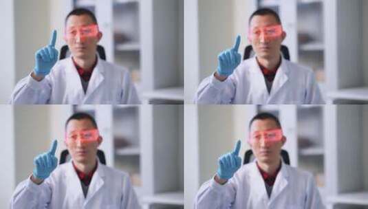 科研实验室戴着VR眼镜男技术人员点击屏幕高清在线视频素材下载