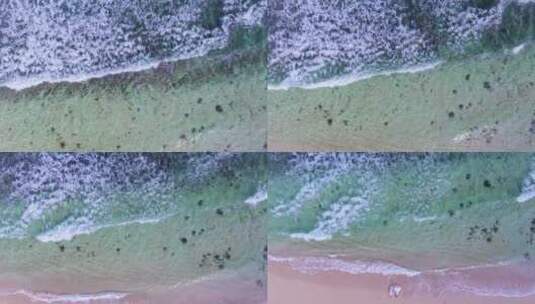 俯拍白色海浪推向海滩高清在线视频素材下载