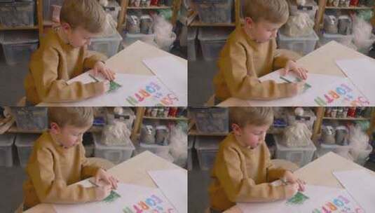 用绿色铅笔绘画的男孩高清在线视频素材下载