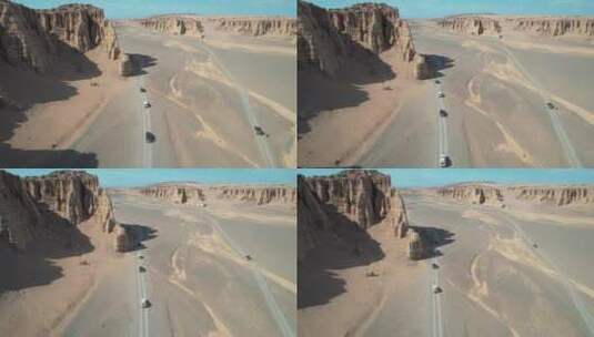航拍新疆哈密大海道无人区荒漠上行驶的汽车高清在线视频素材下载