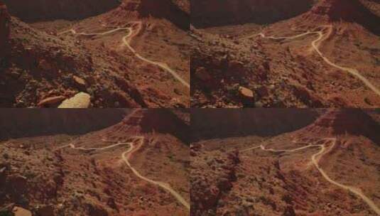 航拍车辆在众神之谷沙漠公路上行驶高清在线视频素材下载