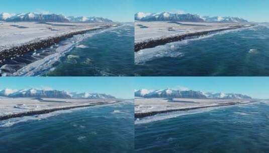 航拍冬季雪后的海岸礁石海浪高清在线视频素材下载