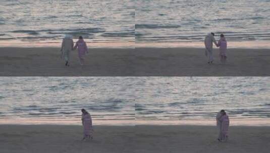 海边沙滩上散步的情侣高清在线视频素材下载