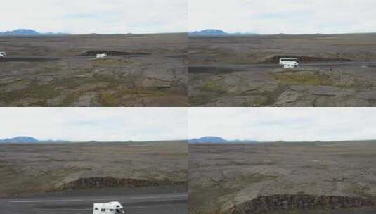 位于冰岛熔岩场的休闲车和旅游巴士，无人机视频向前移动高清在线视频素材下载