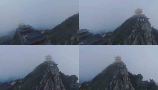 云雾缭绕山峰上的金顶传统建筑高清在线视频素材下载