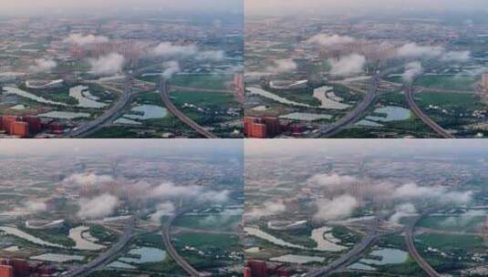 航拍清晨城市云海下的交通枢纽高清在线视频素材下载