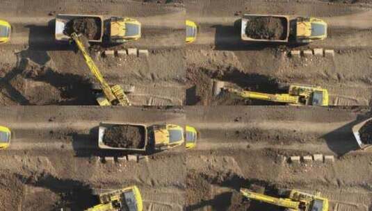 挖掘机装载地球的自卸卡车高清在线视频素材下载