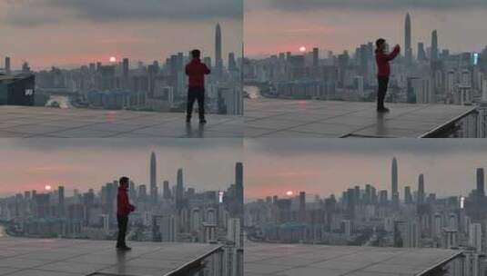 男子站在深圳的高楼顶高清在线视频素材下载