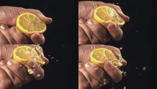 特写手捏碎柠檬流出柠檬汁高清在线视频素材下载