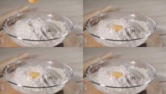 鸡蛋落在一堆面粉上。用高速相机拍摄。慢动高清在线视频素材下载