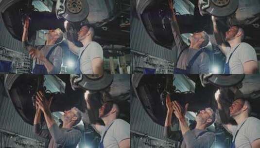 在汽车服务中心，穿着制服的英俊年轻汽车机高清在线视频素材下载