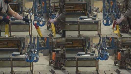工厂工人从起重机吊钩上取下吊带高清在线视频素材下载