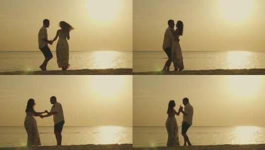 唯美落日黄昏海边 夫妇的剪影高清在线视频素材下载