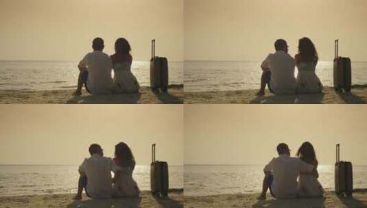年轻夫妇坐在海边的背影高清在线视频素材下载