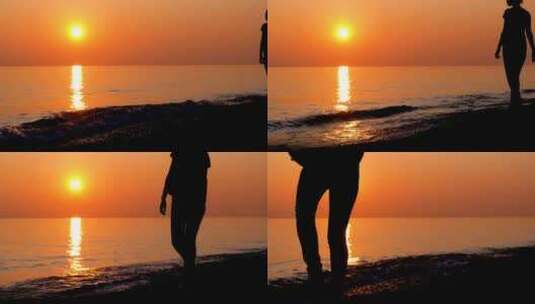 女人海边夕阳下沙滩走路散步剪影高清在线视频素材下载