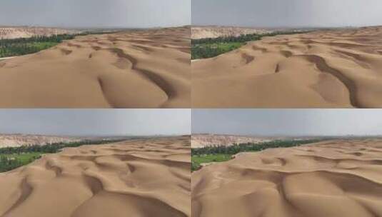 无人机航拍新疆吐鲁番沙漠中的绿洲高清在线视频素材下载