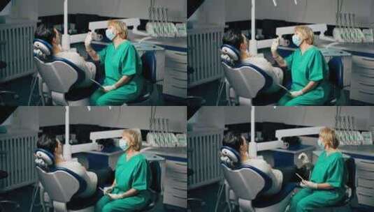 一名牙科诊所病人与一名拿着镜子咨询的女牙高清在线视频素材下载