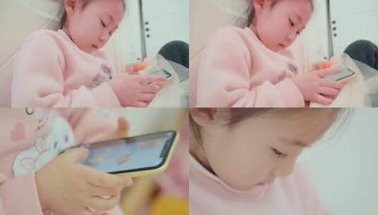 低头看手机玩游戏的小女孩眼神特写高清在线视频素材下载