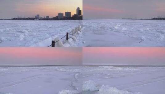 城市旁边冰冻的人行道，旁边是一个白雪覆盖高清在线视频素材下载