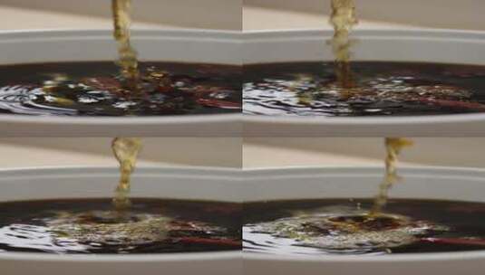 4K竖屏酱油倒入汤水里高清在线视频素材下载