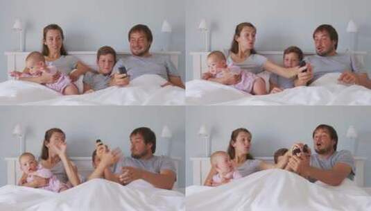 一家人在床上看电影高清在线视频素材下载