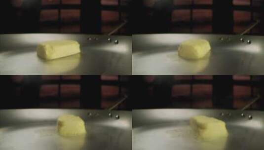 一块黄油在锅中融化高清在线视频素材下载
