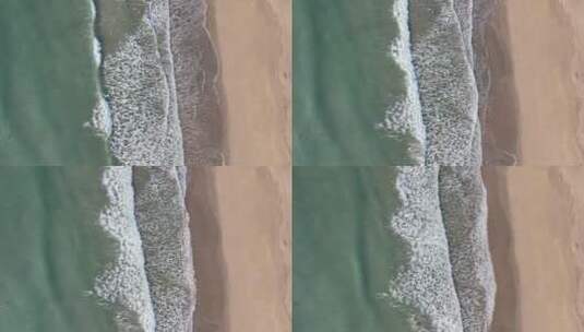 航拍深圳大鹏新区西涌沙滩海浪升格慢动作高清在线视频素材下载