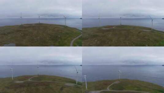 航拍海边岸上风车转动高清在线视频素材下载