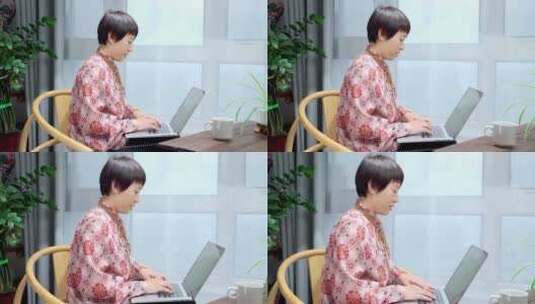 居家使用笔记本电脑办公的中国女性形象高清在线视频素材下载